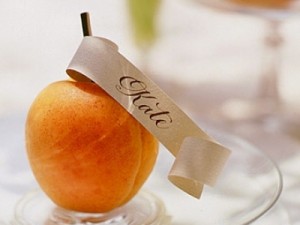 Calligraphy place card holder with lovely fresh peach