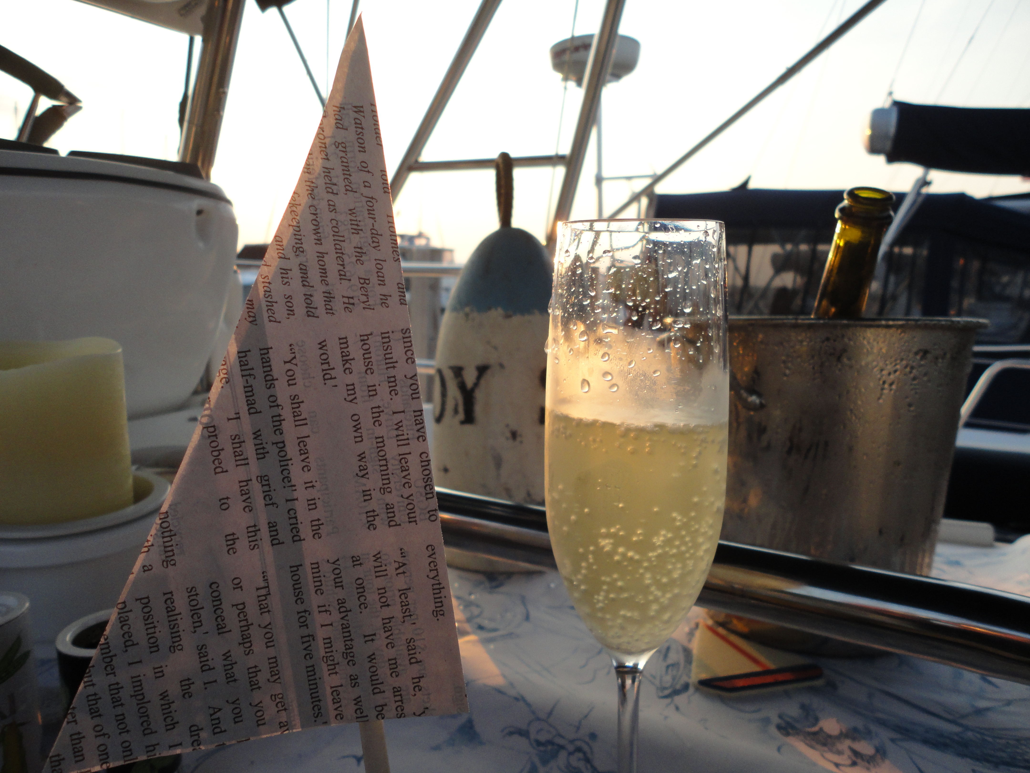 Newspaper sail and champagne glass