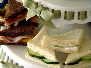 Finger or tea sandwiches presented on tiered cake plates