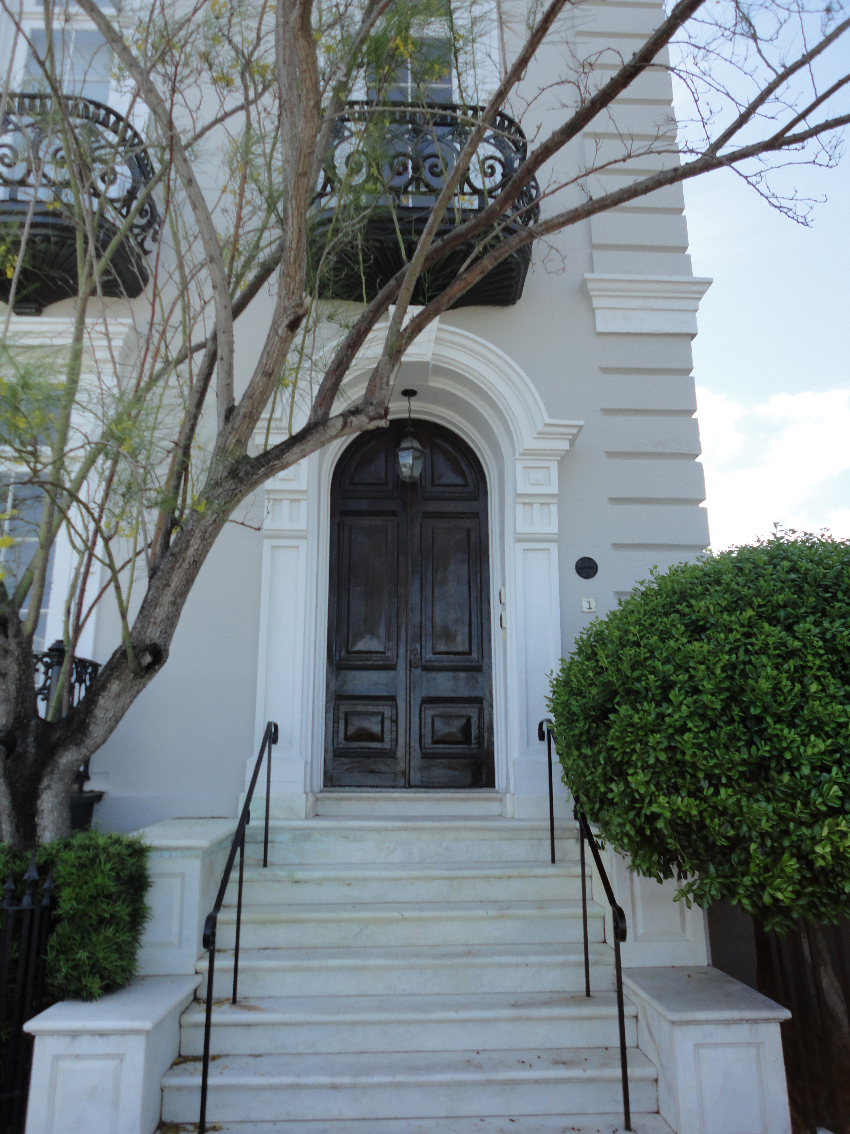 Lovely arched front door to a historic home in Charleston, South Carolina