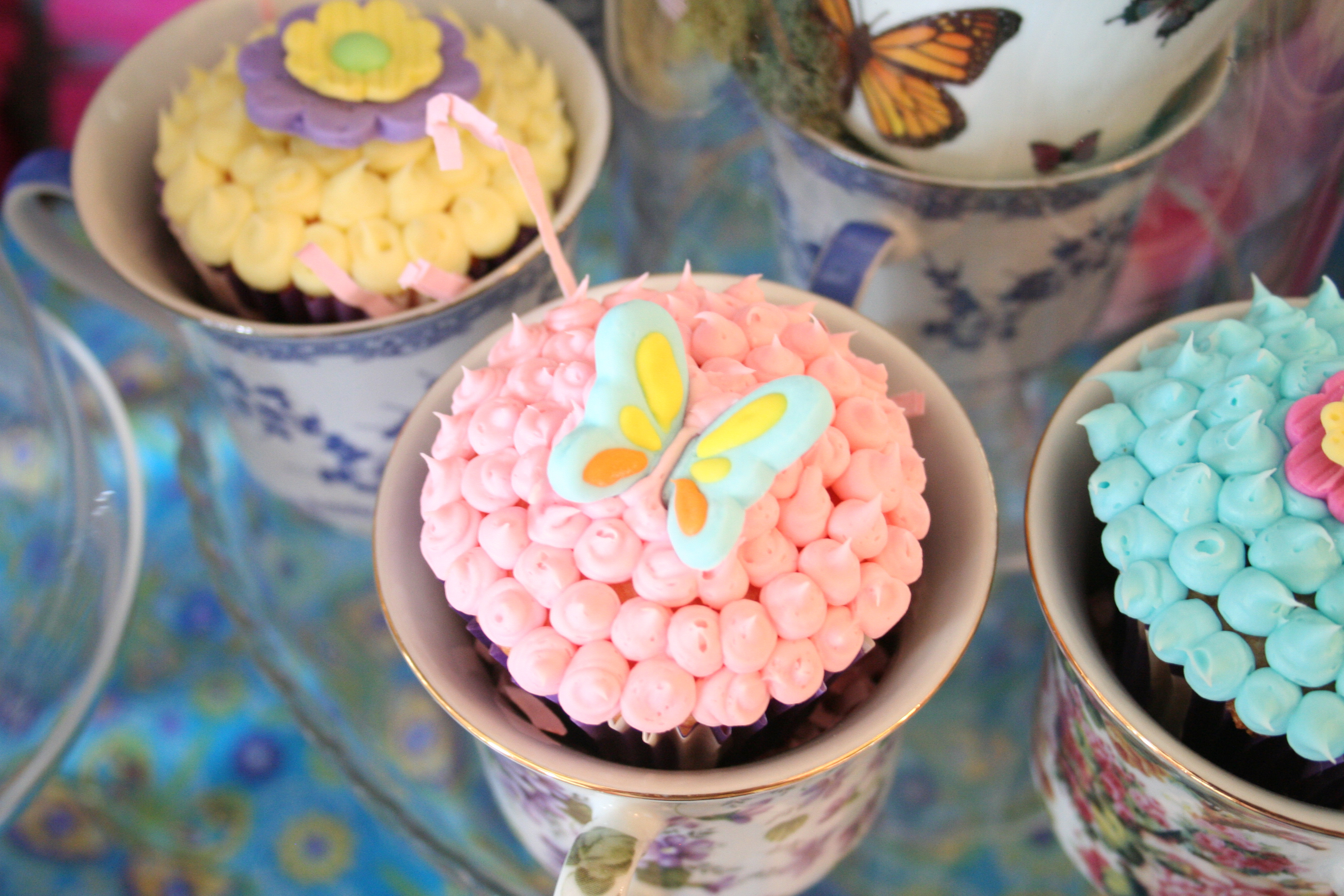 Alice in Wonderland Baby Shower Cupcakes decorated with sugar butterflies