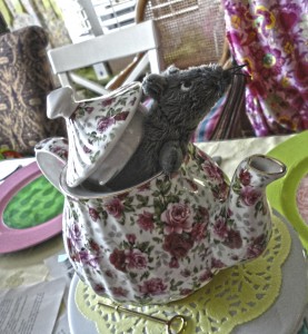 The Dormouse from Alice in Wonderland made an appearance at the shower by popping his head out of a pretty floral teapot.