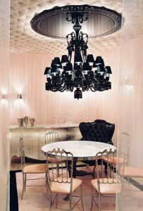 Glamourous Dining room in pale pink and black with black chandelier