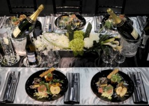 Dinner party tablescape with bottles of champagne