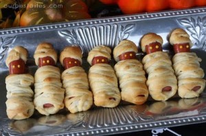 Hot dogs baked in crescent rolls to look like little mummies for a Halloween Party