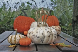 A Royal Pumpkin among the common pumpkins hand decorated for Halloween