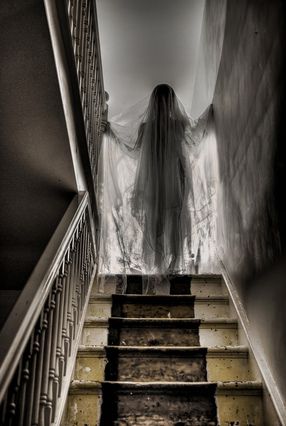 Spooky ghost at the top of the stairs.