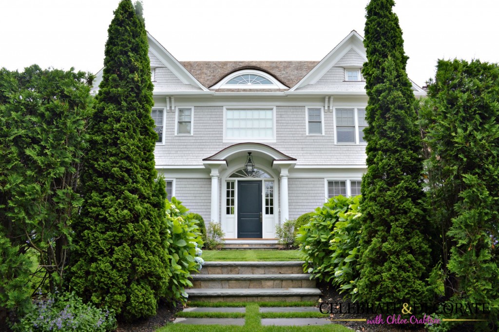 Gray shingled home with an eyebrow window in the Hamptons