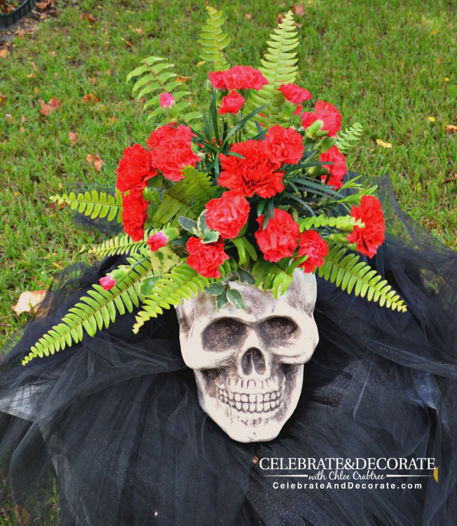 A Halloween Flower Arrangement in a Skull