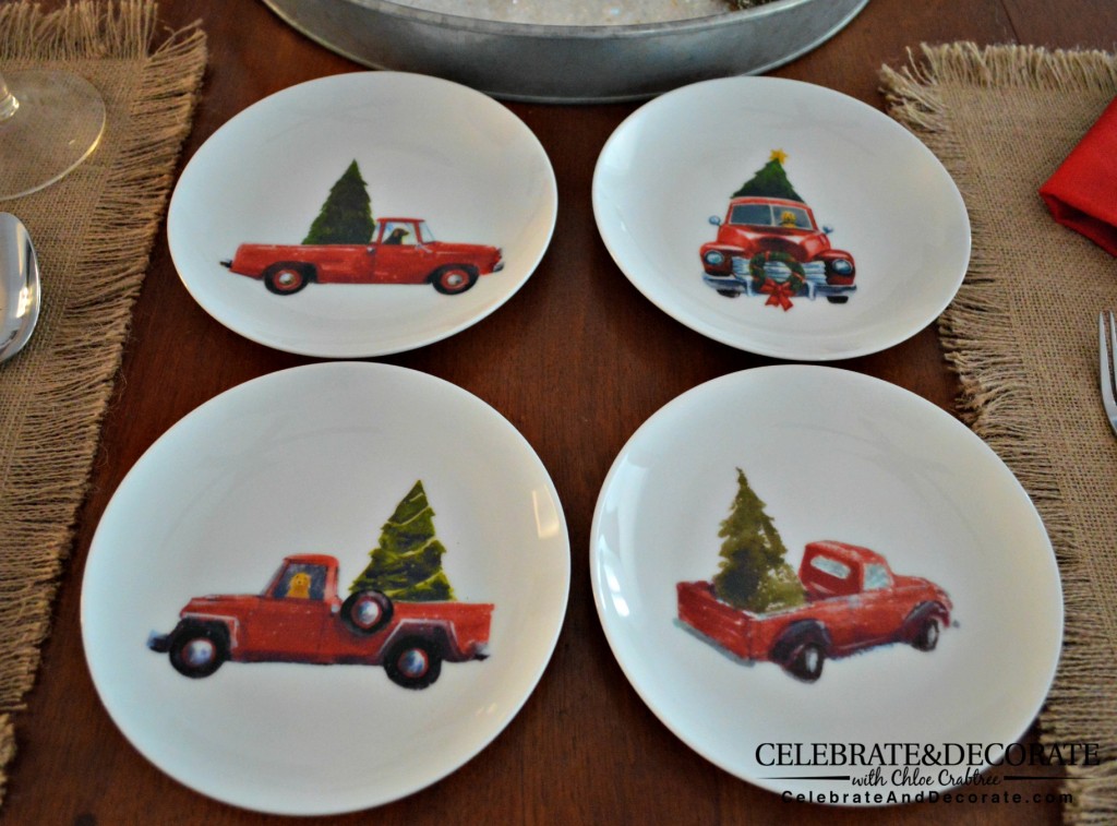 Christmas dessert plates featuring red trucks with Christmas trees
