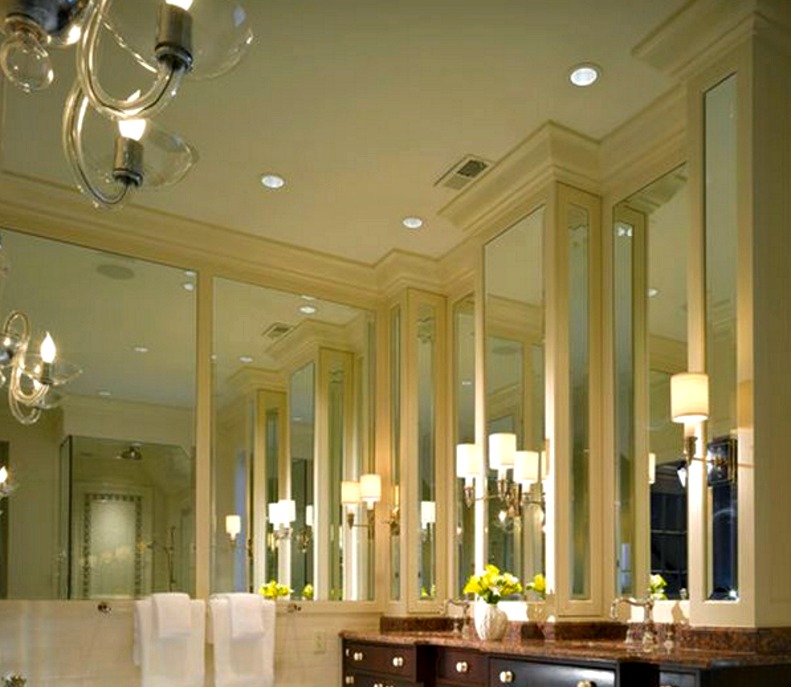 Elegant mirrored walls with wood trim.