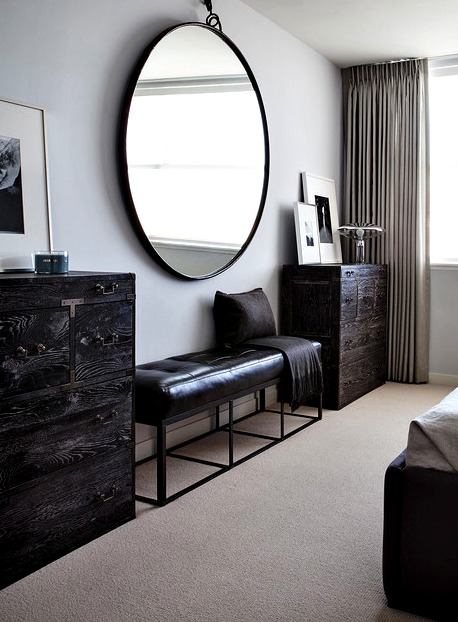 Oversized Round Mirror in a bedroom
