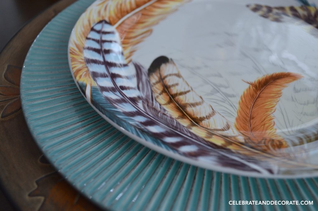 Feather decorated salad plates for a Thanksgiving tablescape