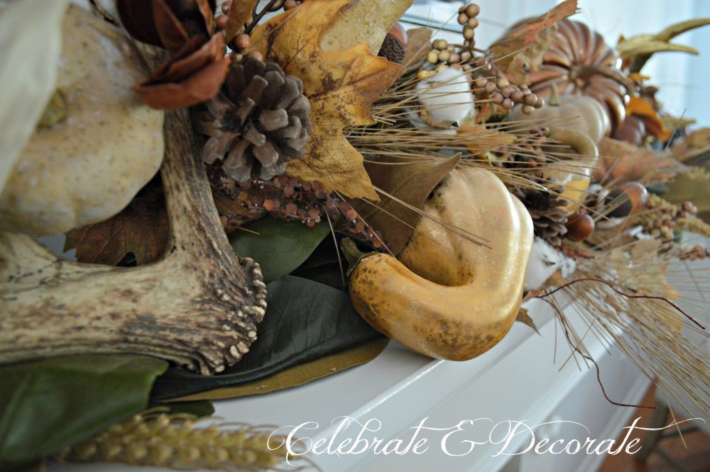 Antlers and Gourds share this mantel that is decorated for Thanksgiving