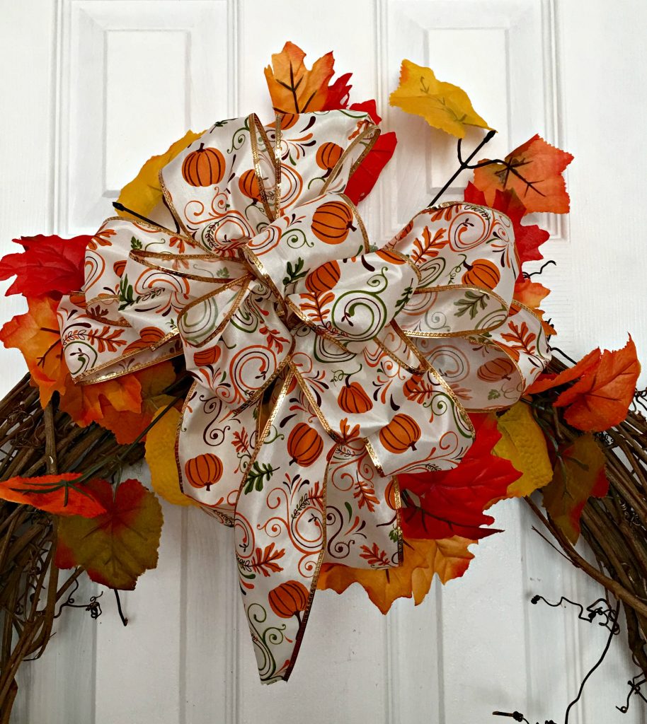 Make a fall wreath with a cute little scarecrow