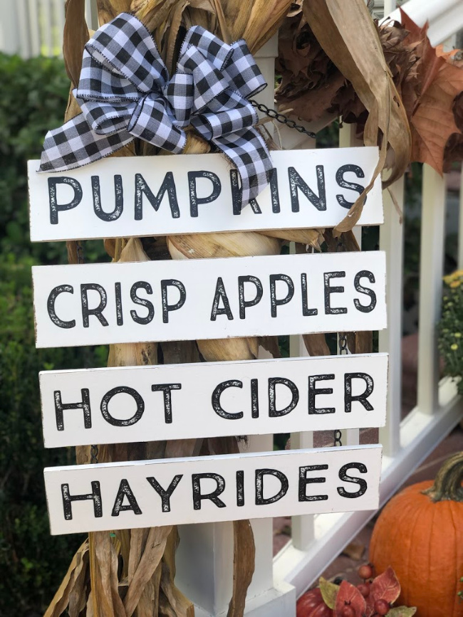Fall front porch sign with pumpkins, crisp apples, hot cider and hayrides