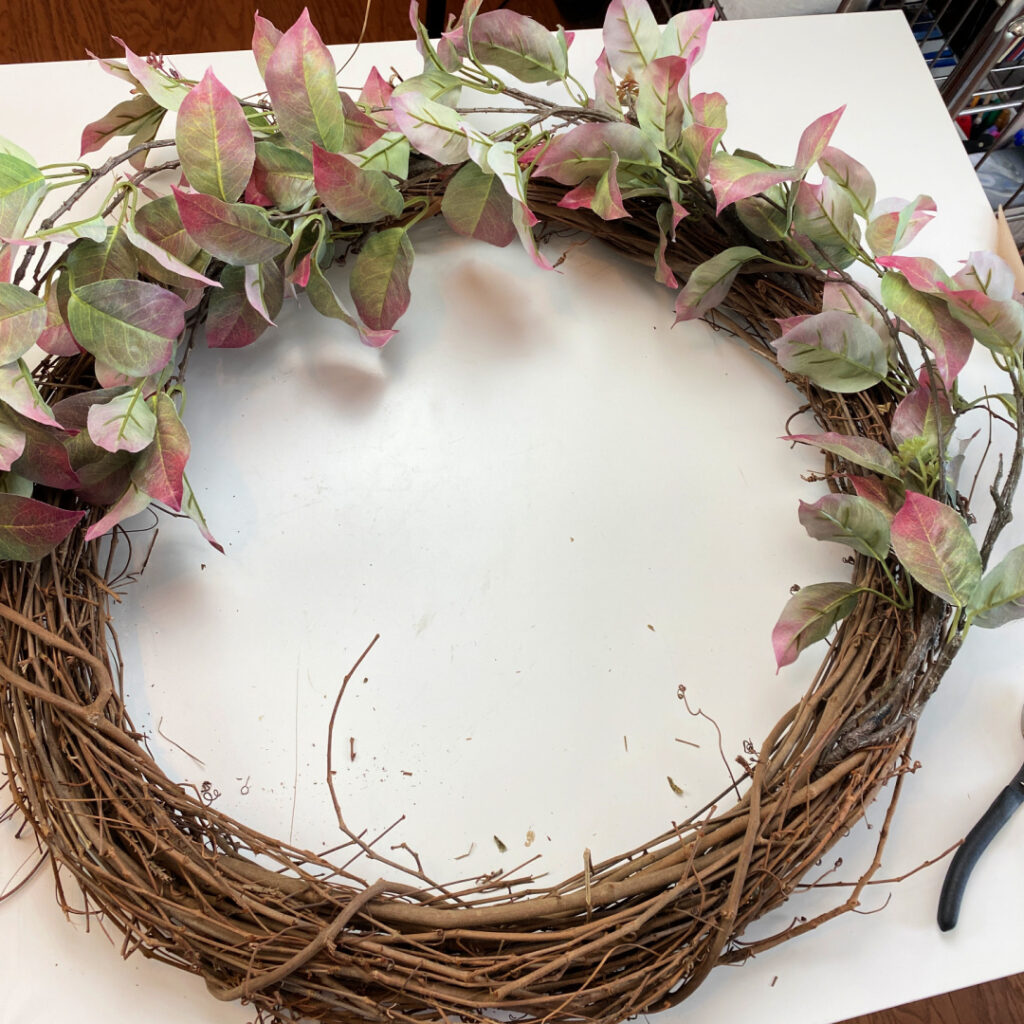 grapevine wreath with faux fall dogwood branches