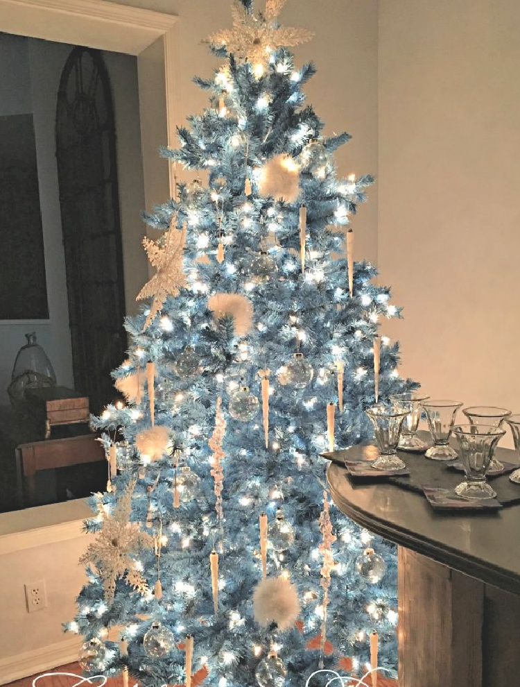 white christmas tree with blue lights