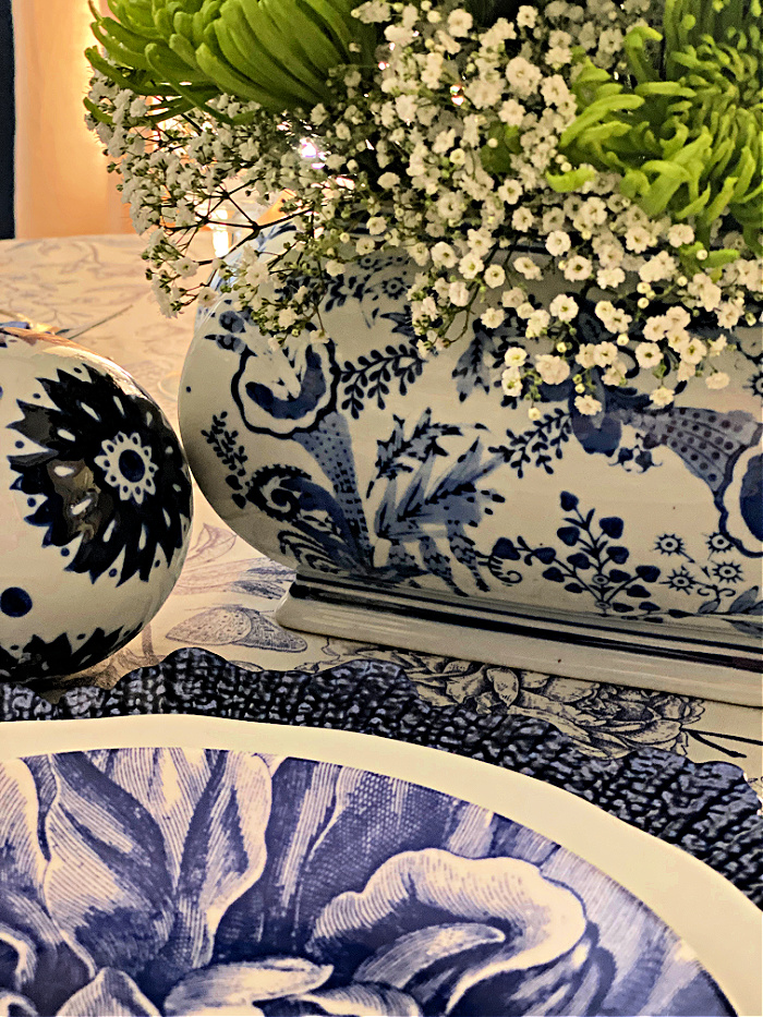 Blue and white tablescape with beautiful blue and white dishes and a blue and white china chinoiserie vase
 