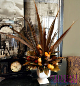 pheasant feather and magnolia leaf arrangement for fall