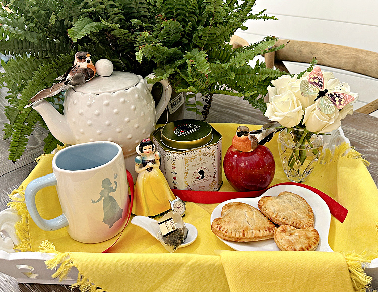 A pretty tea tray with a snow white theme. 