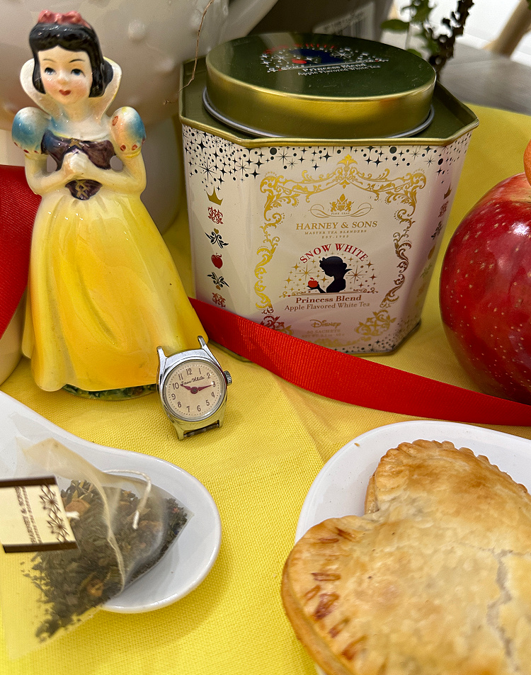 A 1960 Snow white figurine and an original 1960 snow white watch along with a tin of Snow White tea