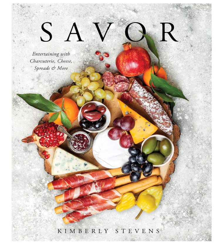 The cover a book called Savor with a picture of a charcuterie board on the cover.  