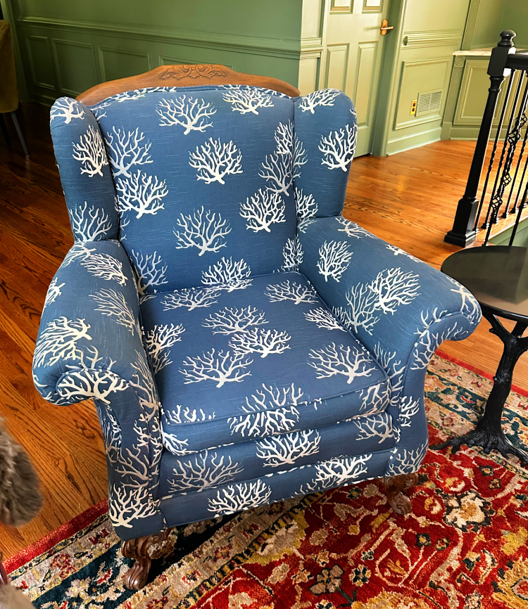 Chair in its coastal upholstery before a new makeover for Foxglove Hill.
